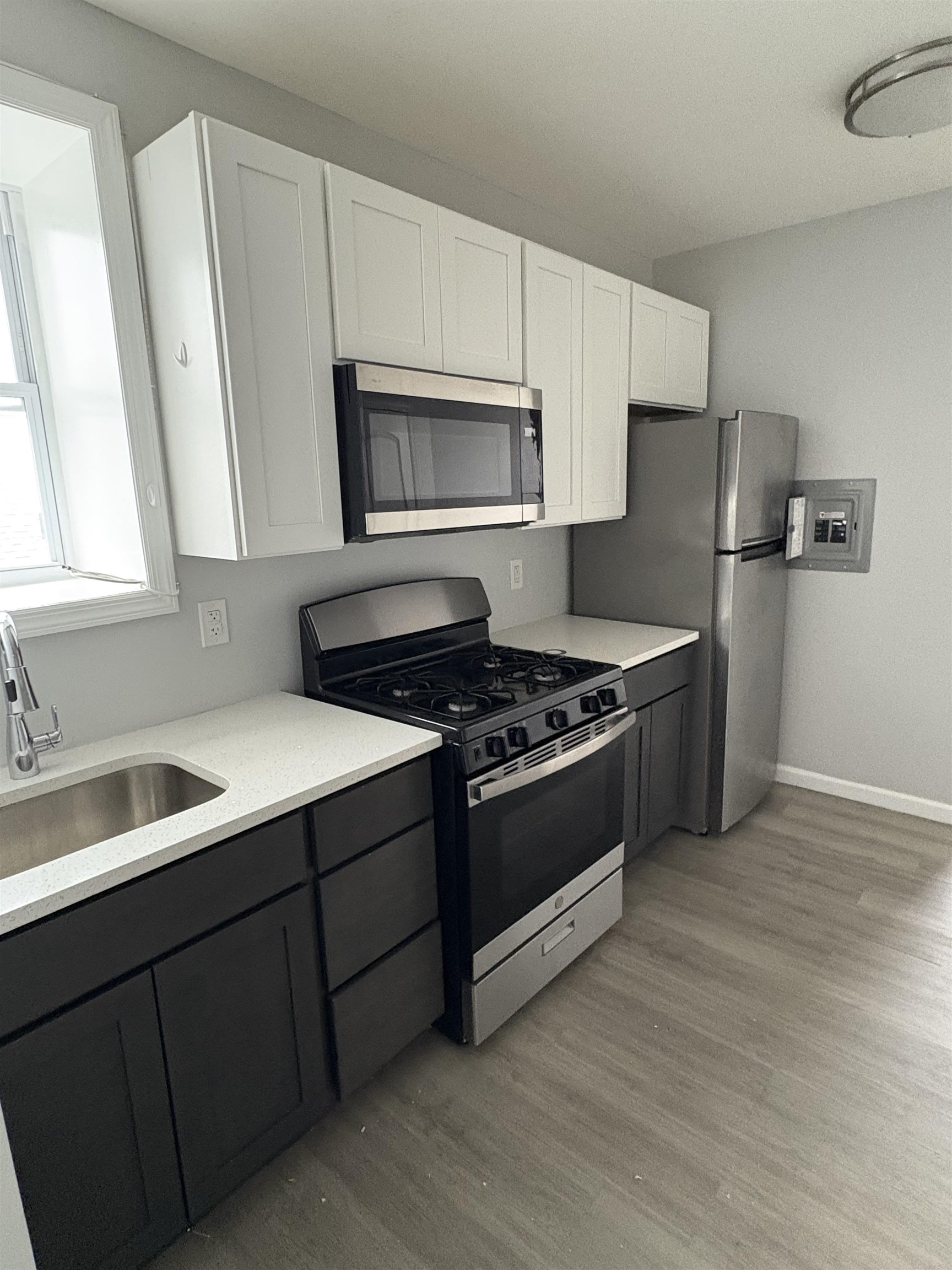 17 Teaneck Road, Unit 3C Ridgefield Park, NJ 07660 - Photo 2 of 8 a kitchen with stainless steel appliances granite countertop a sink stove and refrigerator