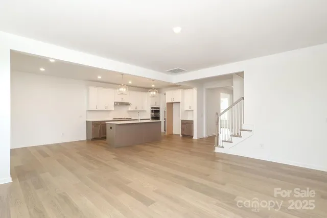 a view of kitchen with wooden floor