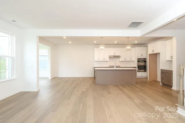 a view of kitchen with wooden floor