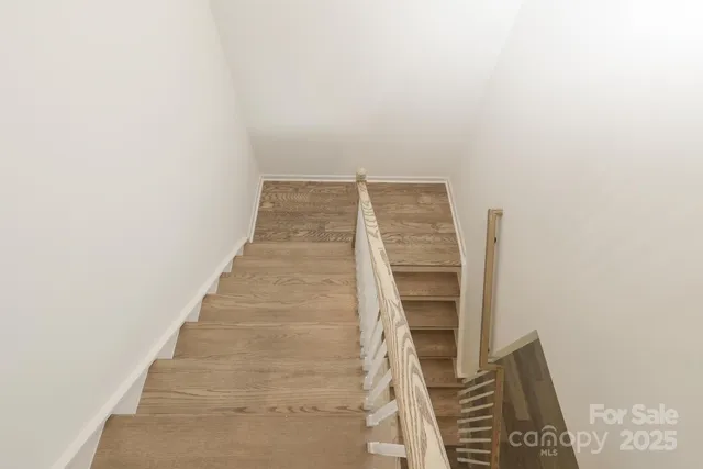 a view of staircase with white walls