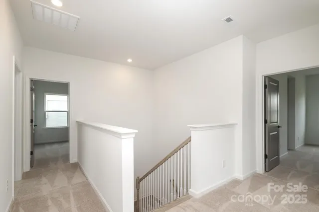 a view of a hallway with an entryway and closet