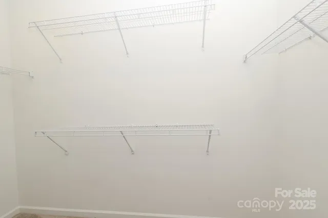 a view of a room with racks on the wall