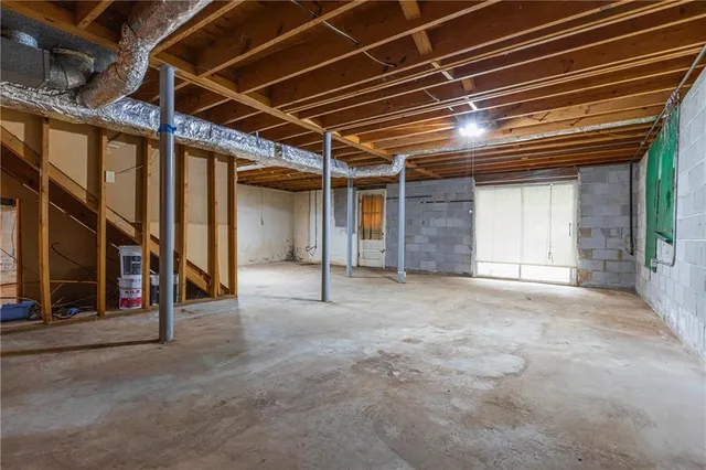 a view of an empty room with stairs