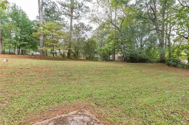a view of a field with an trees