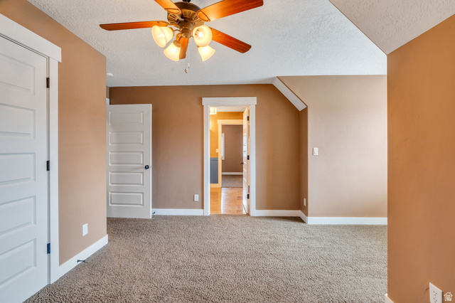 1355 West 1000 South Mapleton, UT 84664 - Photo 41 of 74 Unfurnished bedroom featuring a textured ceiling, light colored carpet, and ceiling fan