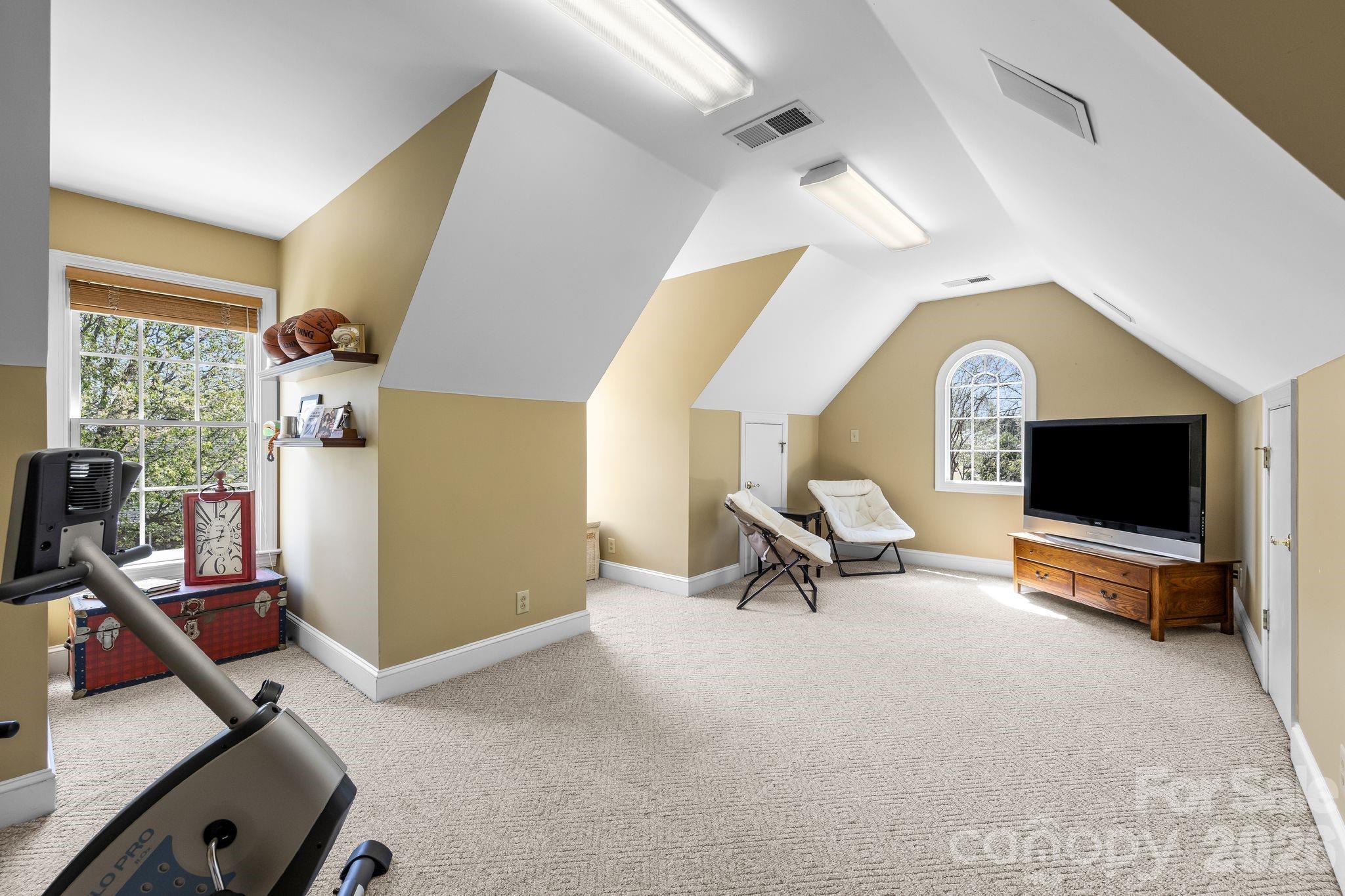 3530 Cardiff Lane Matthews, NC 28104 - Photo 32 of 39 a living room with furniture and a flat screen tv