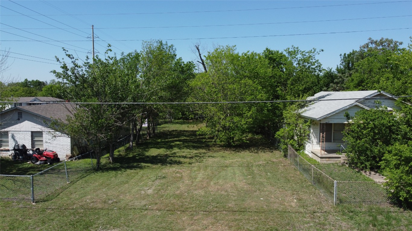 408 Symes Street Taylor, TX 76574 - Photo 1 of 6 a view of a chair and tables in patio of the house