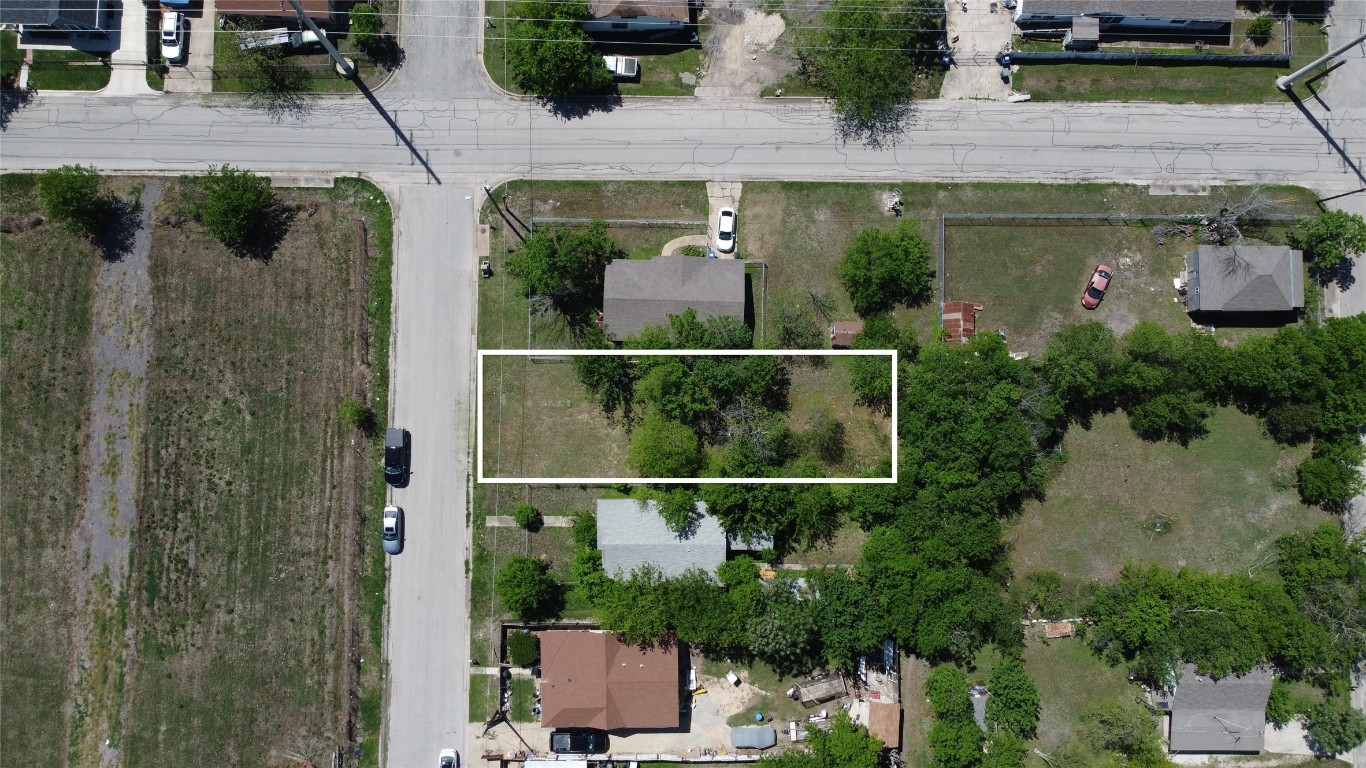 408 Symes Street Taylor, TX 76574 - Photo 3 of 6 an aerial view of a house with garden space and sitting area