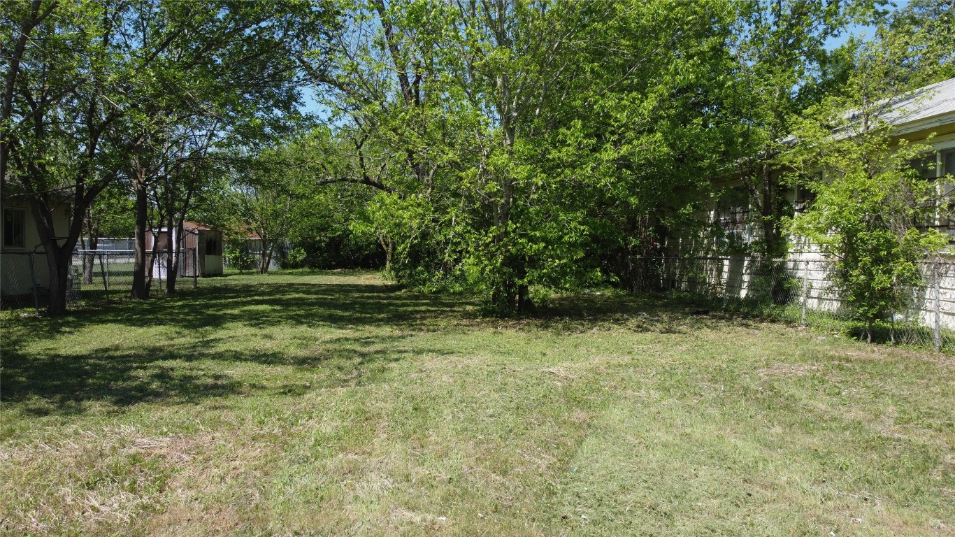 408 Symes Street Taylor, TX 76574 - Photo 5 of 6 a backyard of a house with lots of green space