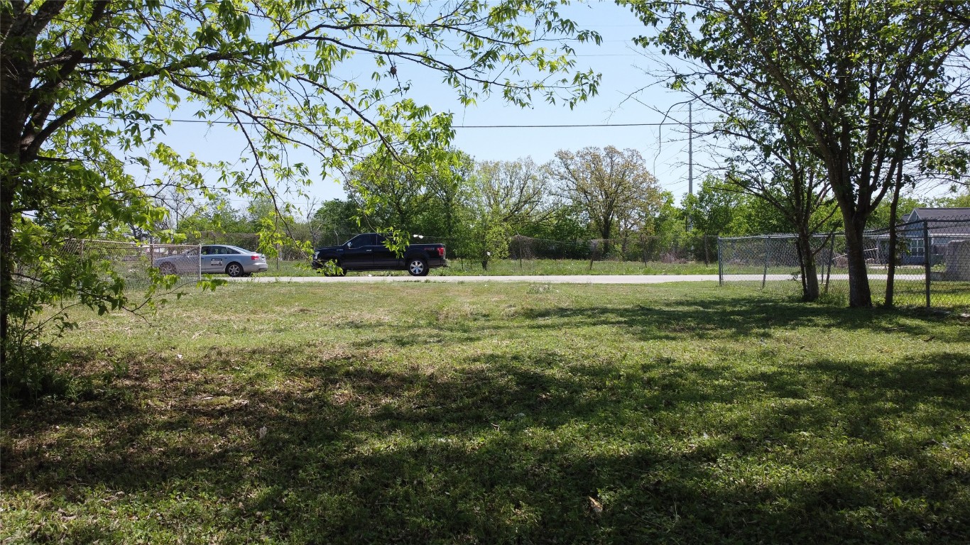 408 Symes Street Taylor, TX 76574 - Photo 6 of 6 a view of outdoor space with trees all around