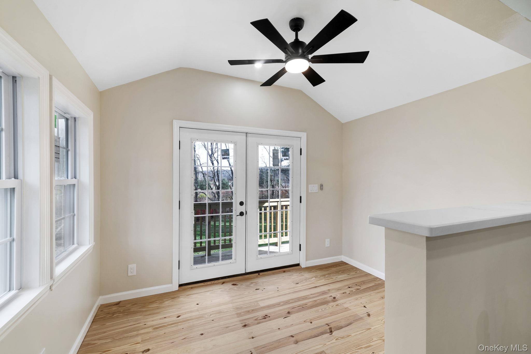 80 Kitz Road Monticello, NY 12701 - Photo 14 of 39 a view of a big room with wooden floor and windows