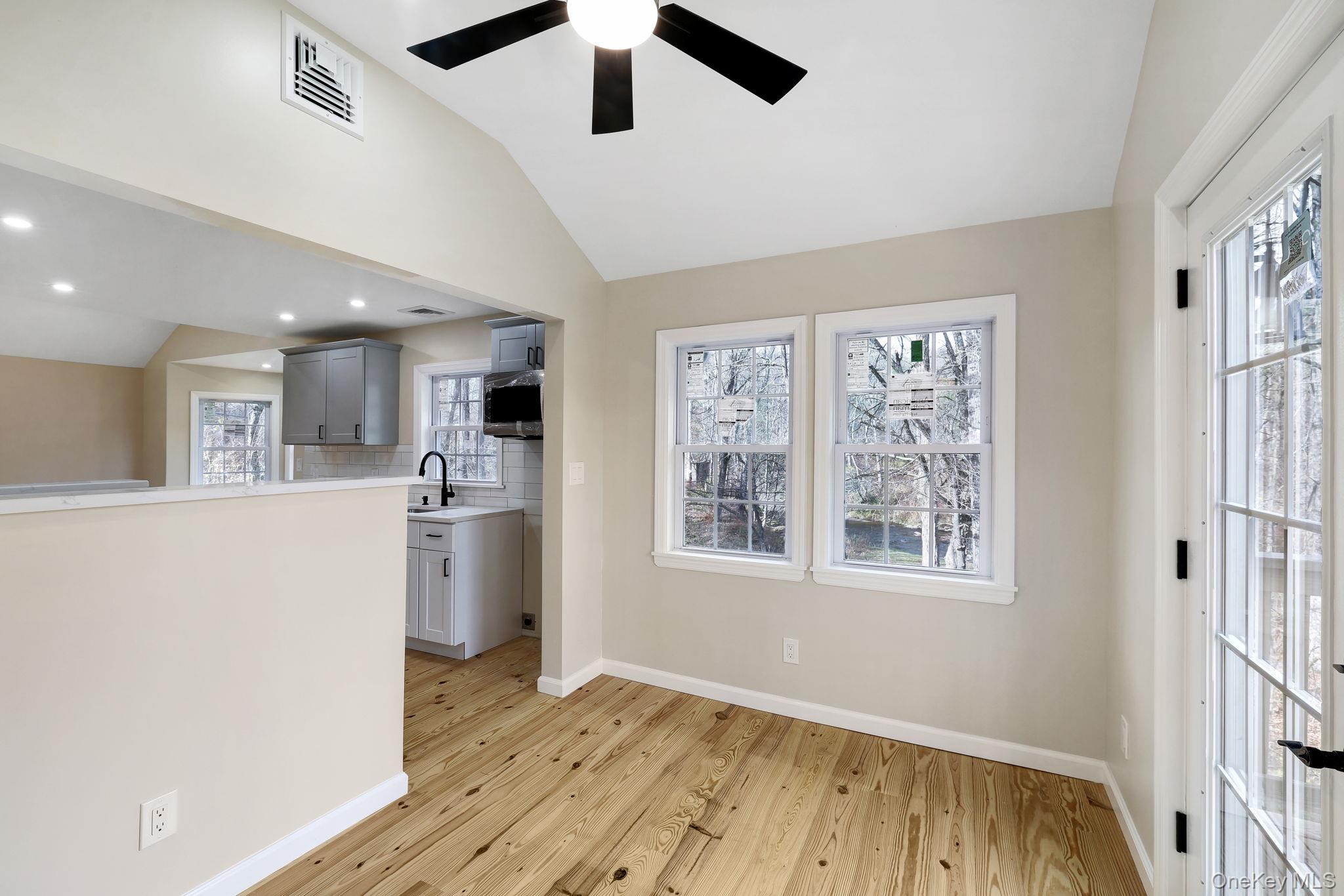 80 Kitz Road Monticello, NY 12701 - Photo 15 of 39 a view of an empty room with a window and wooden floor