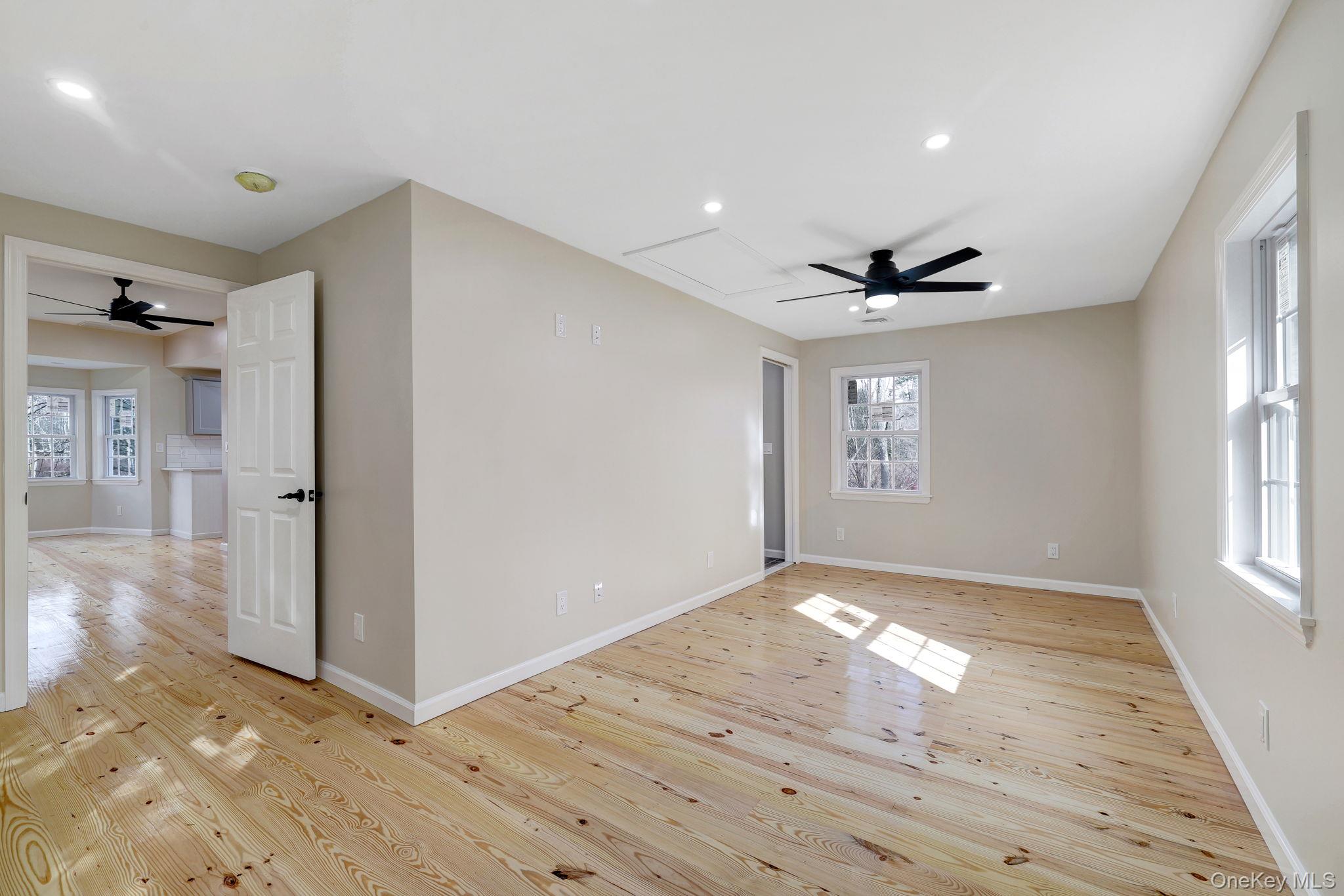 80 Kitz Road Monticello, NY 12701 - Photo 21 of 39 a view of empty room with wooden floor and fan