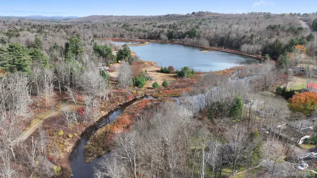 an aerial view of mountain with yard
