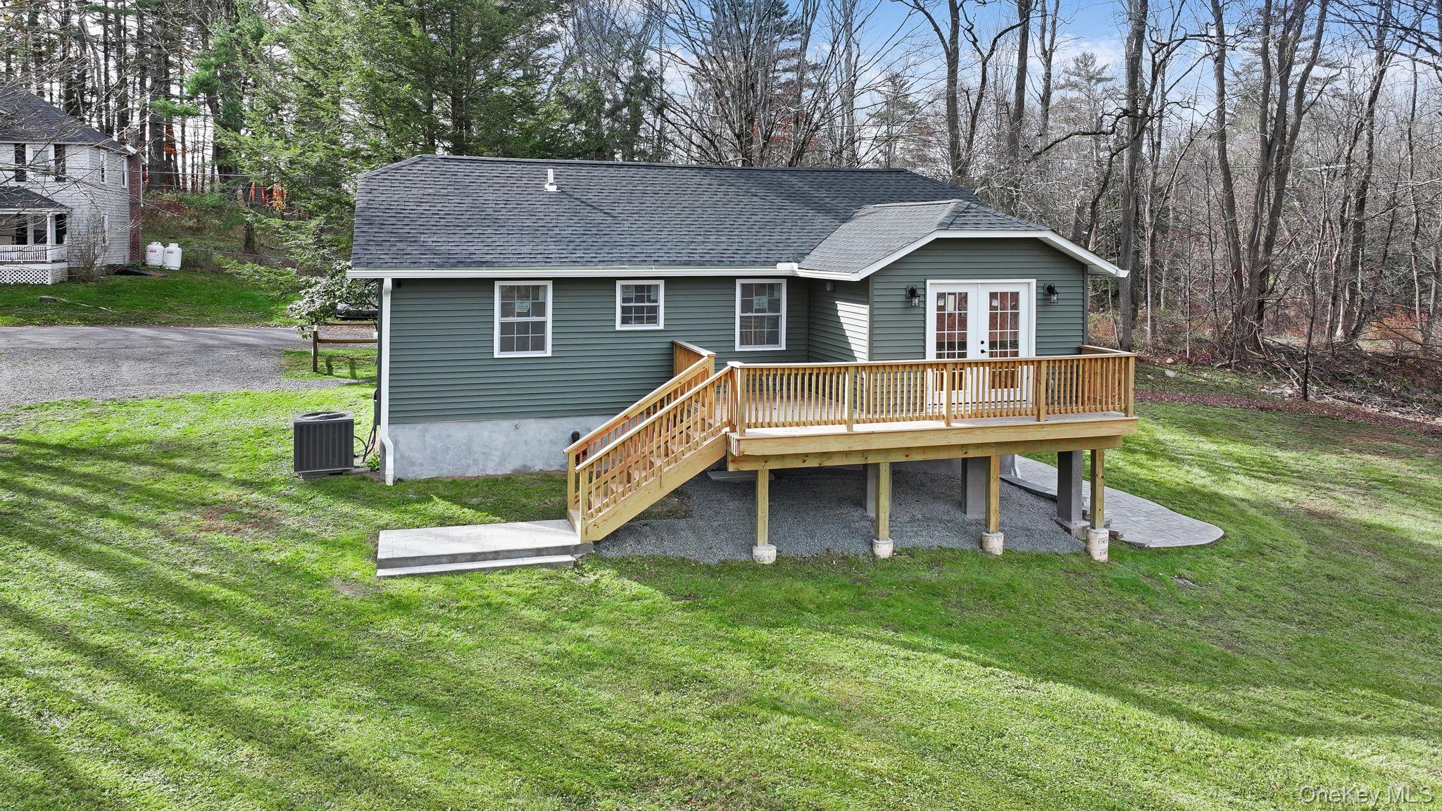 80 Kitz Road Monticello, NY 12701 - Photo 30 of 39 a front view of house with a yard and deck