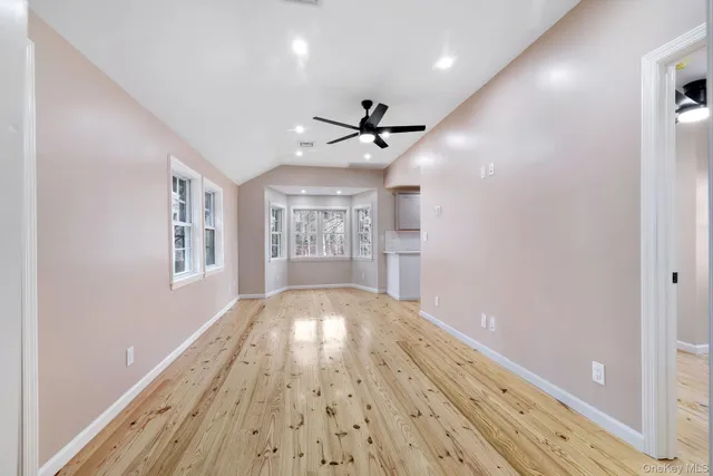 a large kitchen with kitchen island a sink stainless steel appliances and cabinets