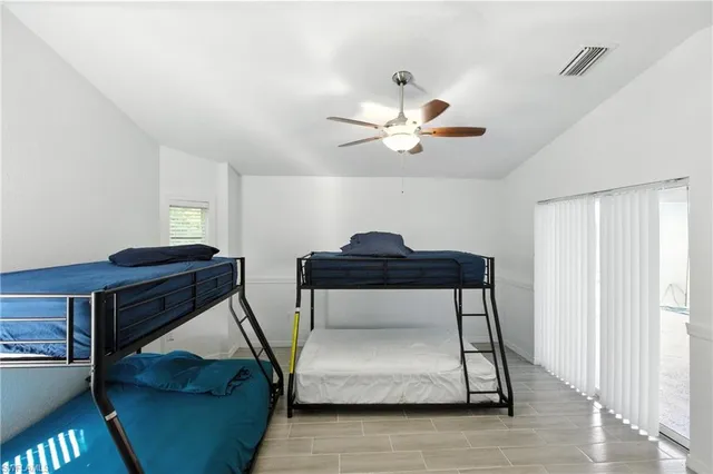 a living room with a couch and a chandelier
