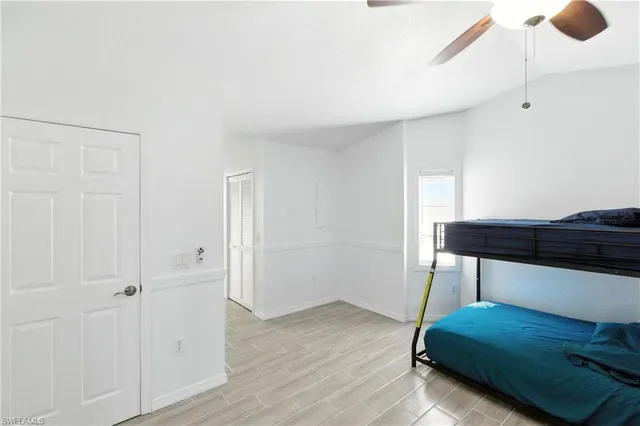 a room with a bed and cabinets