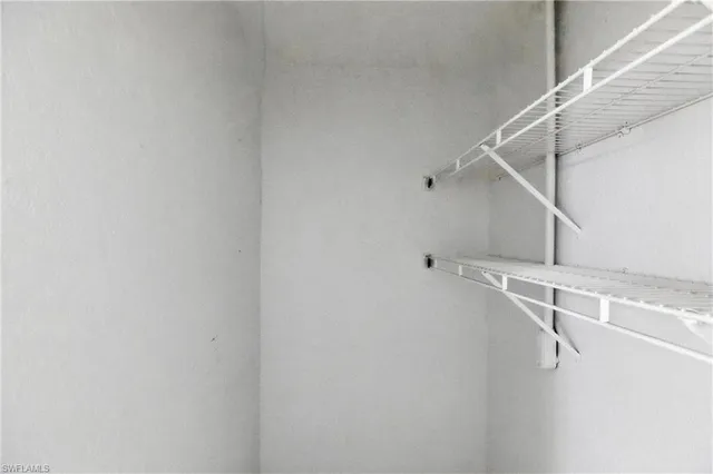 a view of a room with racks on the wall
