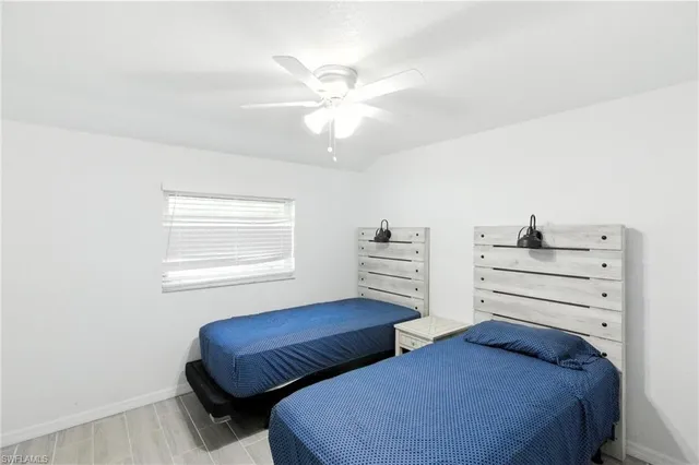 a bedroom with furniture and a window