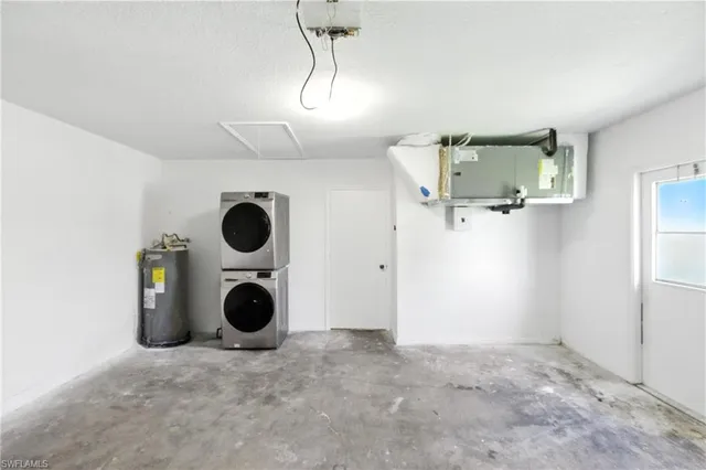a view of a storage & utility room with two washing machine