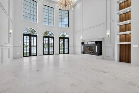 a view of kitchen with refrigerator and window
