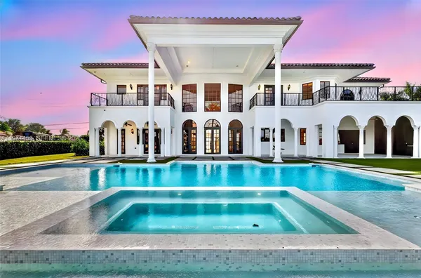 a view of swimming pool with building in the background