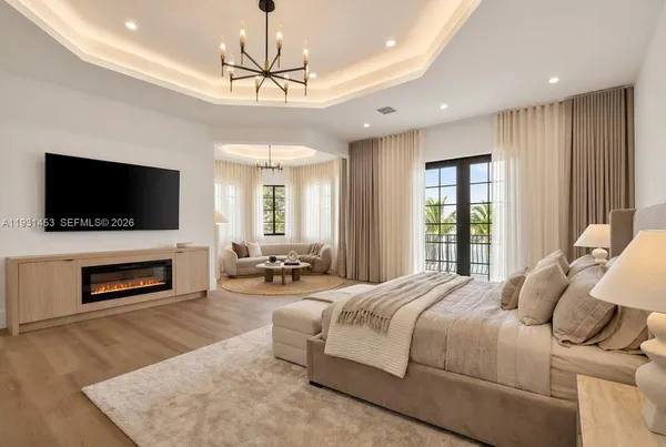 a spacious bedroom with a large bed and a large window