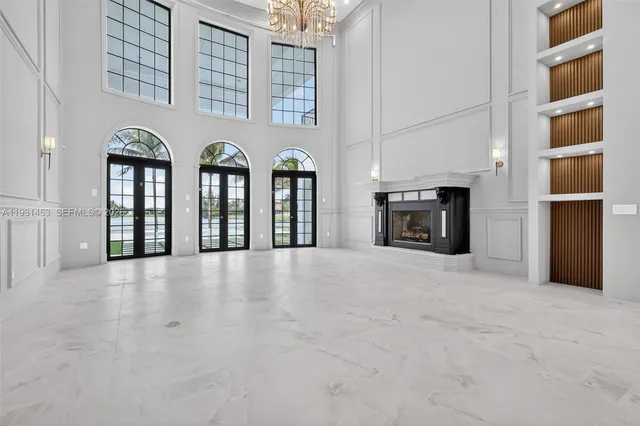 a view of a house with swimming pool and sitting area