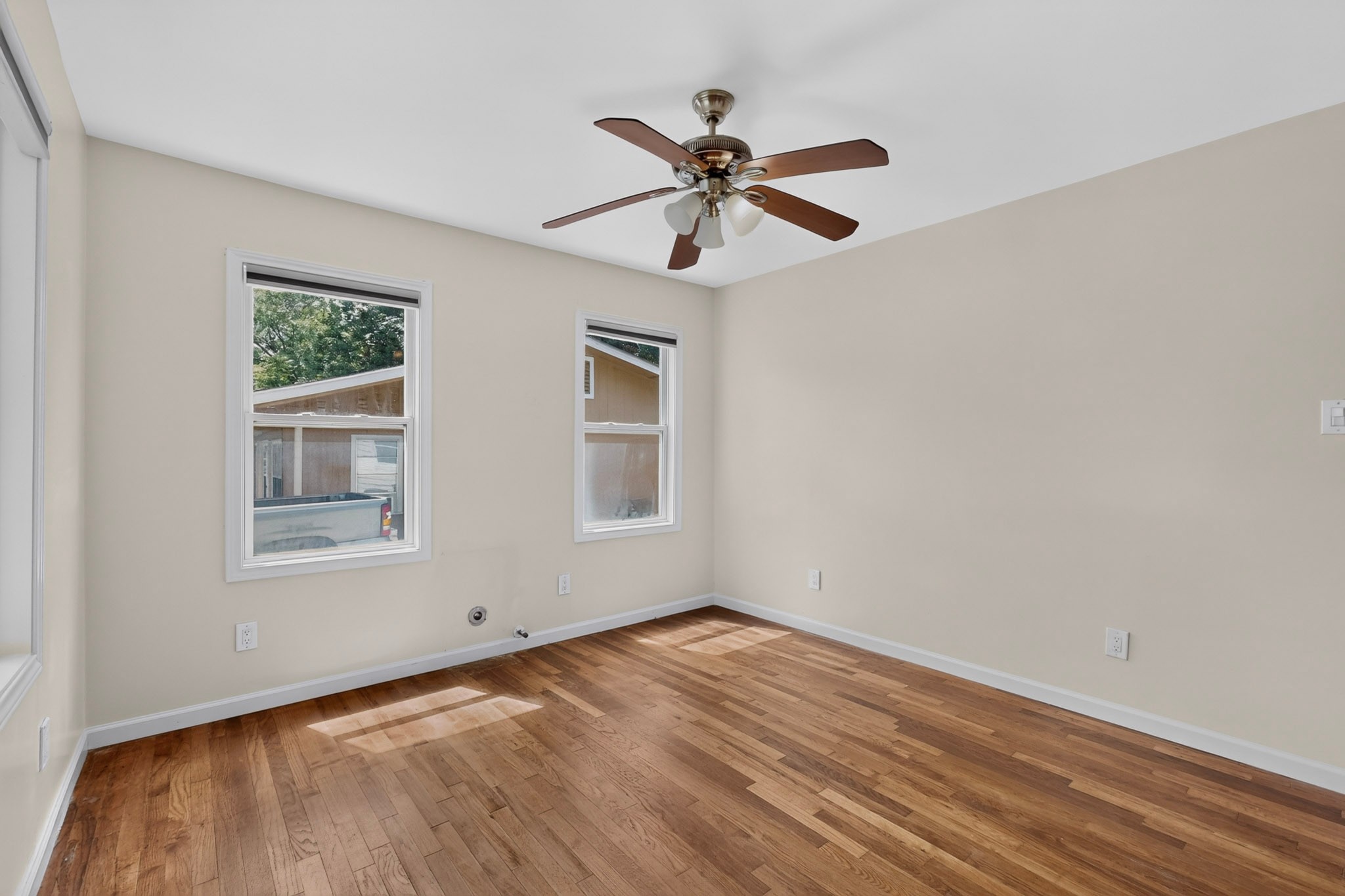4711 Alf Avenue Austin, TX 78721 - Photo 18 of 34 BR1 - Hardwood flooring extends throughout this versatile, well-lit bedroom space.