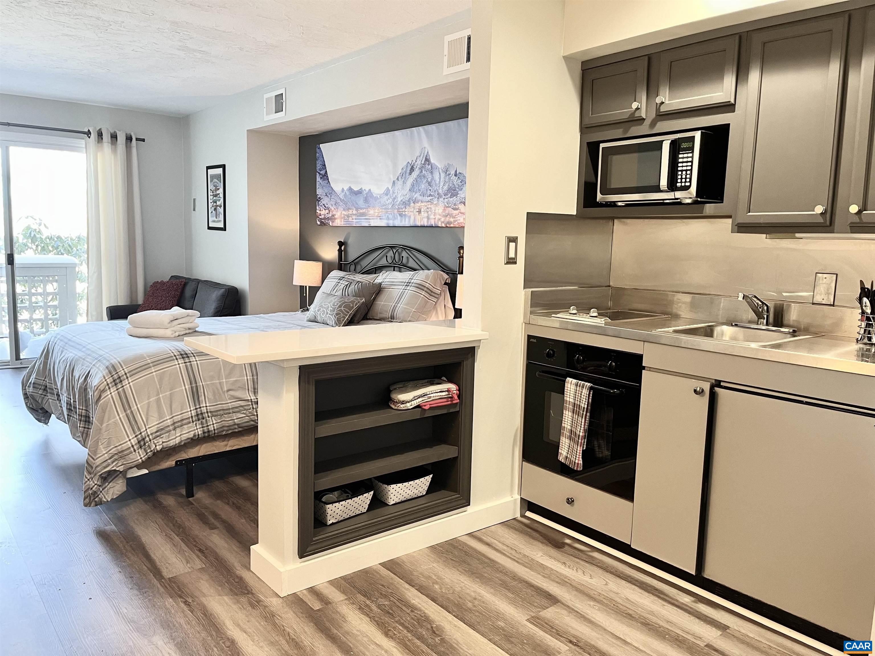 2052 Stone Ridge Wintergreen, VA 22967 - Photo 1 of 17 a bedroom with a bed and a microwave