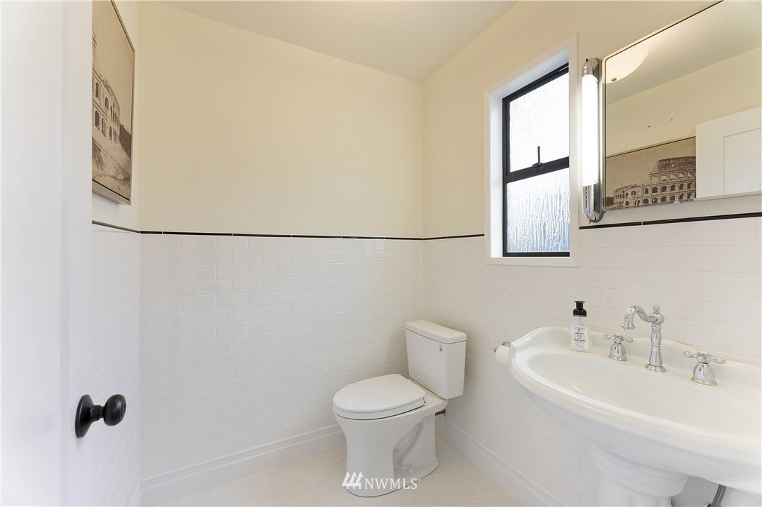 6829 Skipley Road Snohomish, WA 98290 - Photo 14 of 26 a white toilet sitting next to a white sink