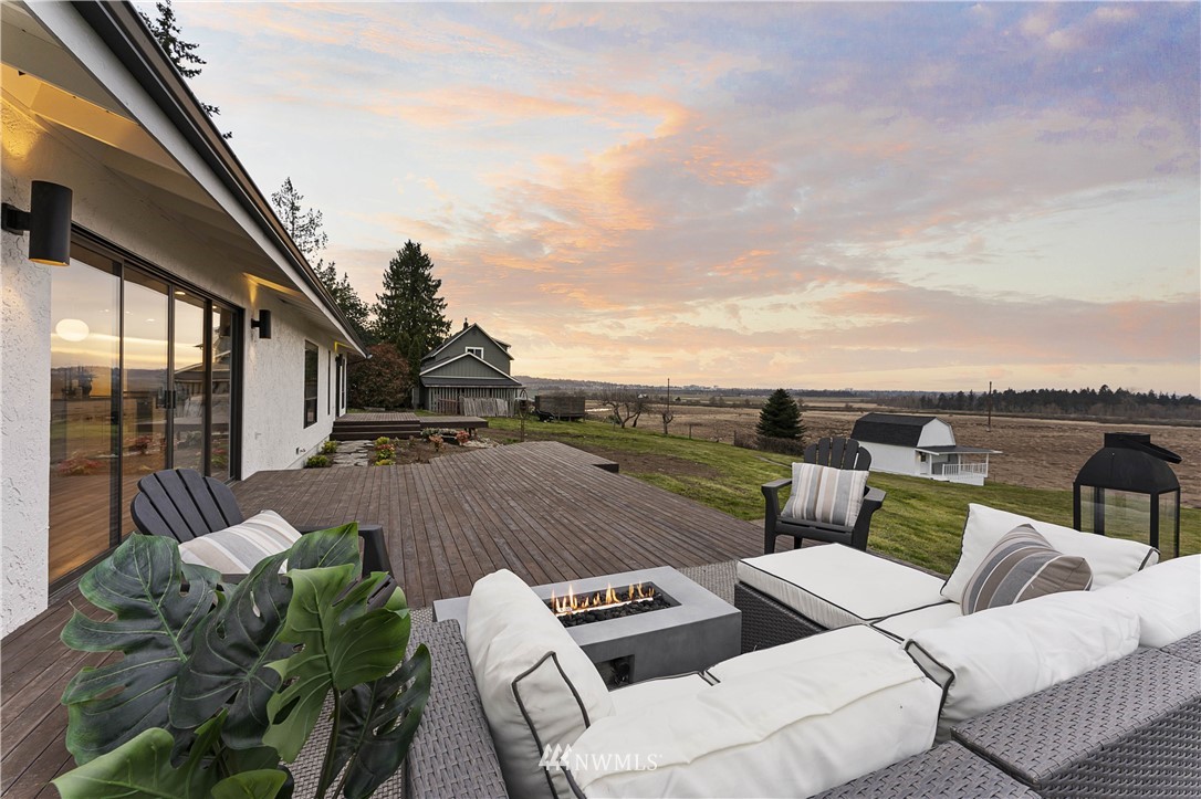 6829 Skipley Road Snohomish, WA 98290 - Photo 22 of 26 a view of a roof deck with couches and sky view
