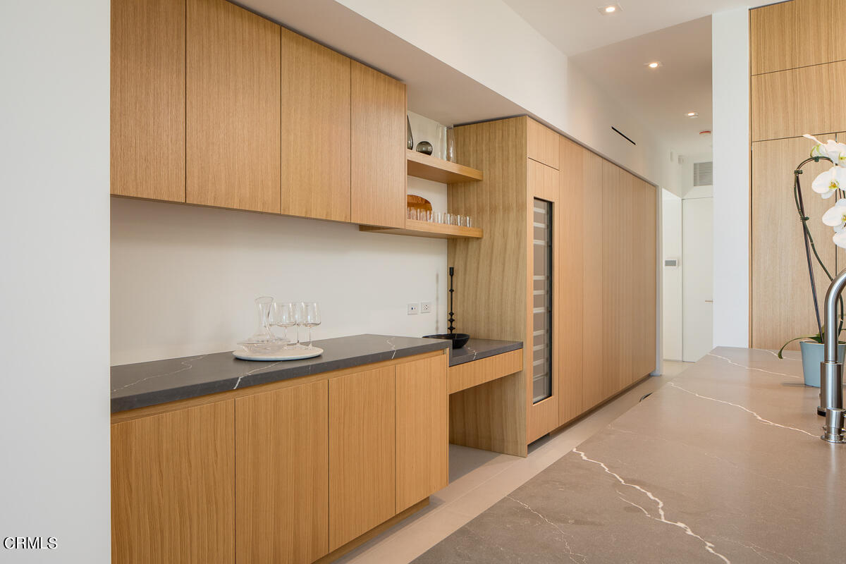 1746 Hanscom Drive South Pasadena, CA 91030 - Photo 25 of 58 a kitchen with stainless steel appliances granite countertop a sink a stove and a refrigerator with cabinets