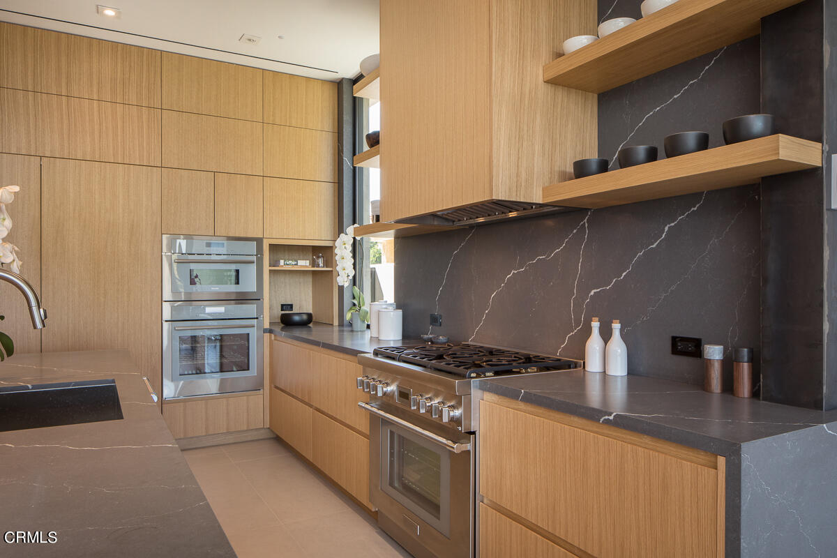 1746 Hanscom Drive South Pasadena, CA 91030 - Photo 26 of 58 a kitchen with stainless steel appliances a stove and a refrigerator