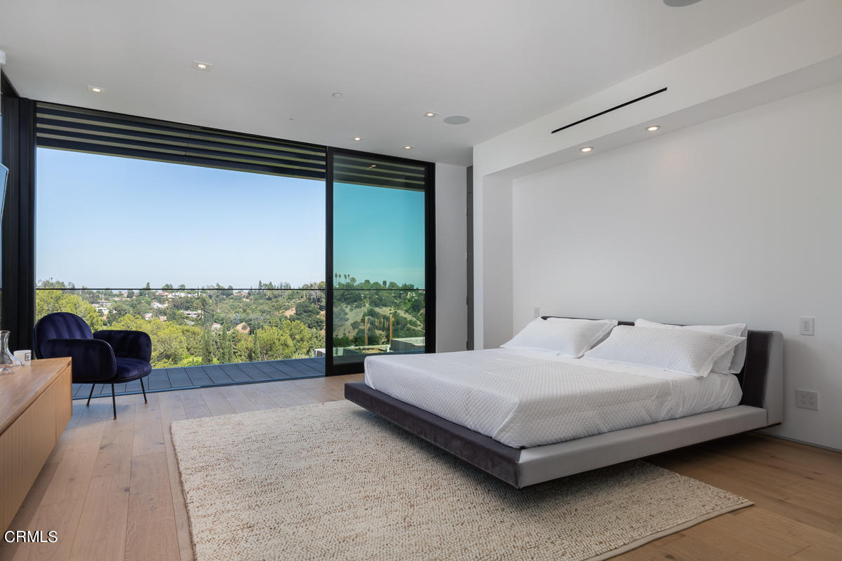 1746 Hanscom Drive South Pasadena, CA 91030 - Photo 28 of 58 a bedroom with a bed and a large window