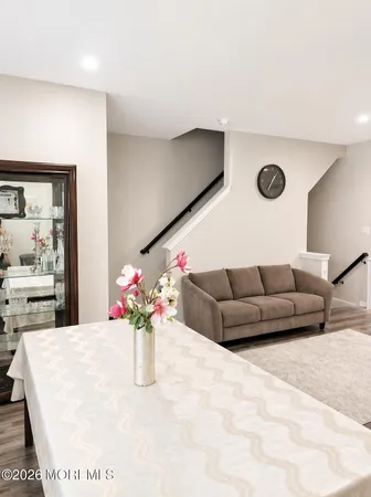 a living room with furniture flowerpot and flower pot