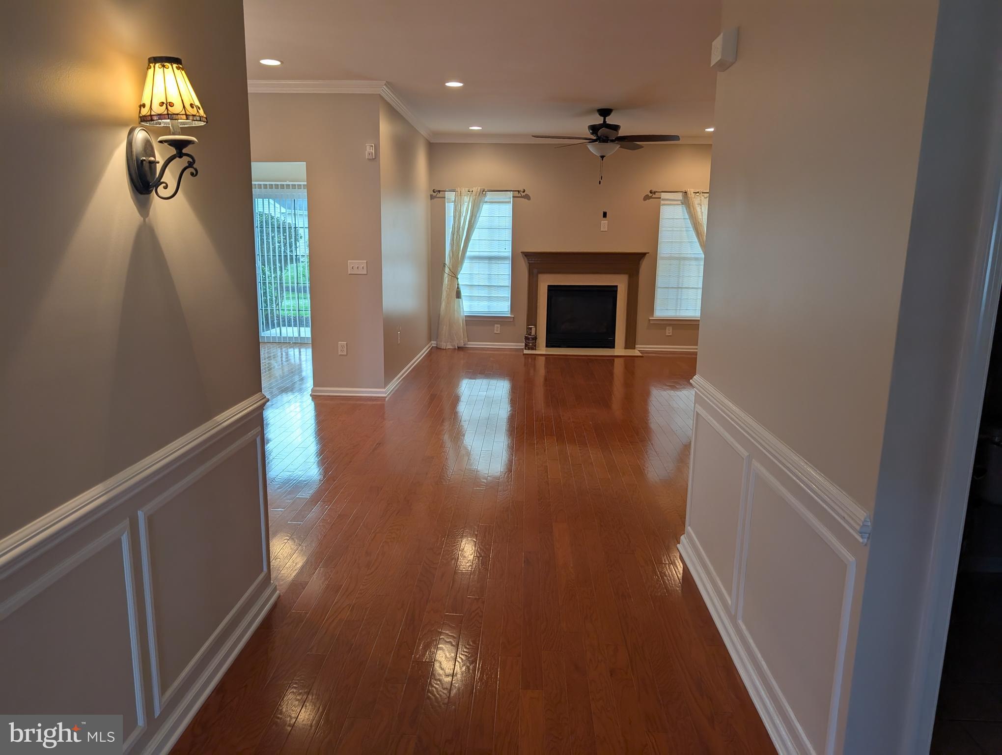 302 Gosling Way Glassboro, NJ 08028 - Photo 2 of 13 wooden floor in an empty room with a fireplace