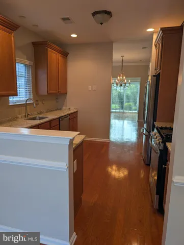a kitchen with a refrigerator and a sink