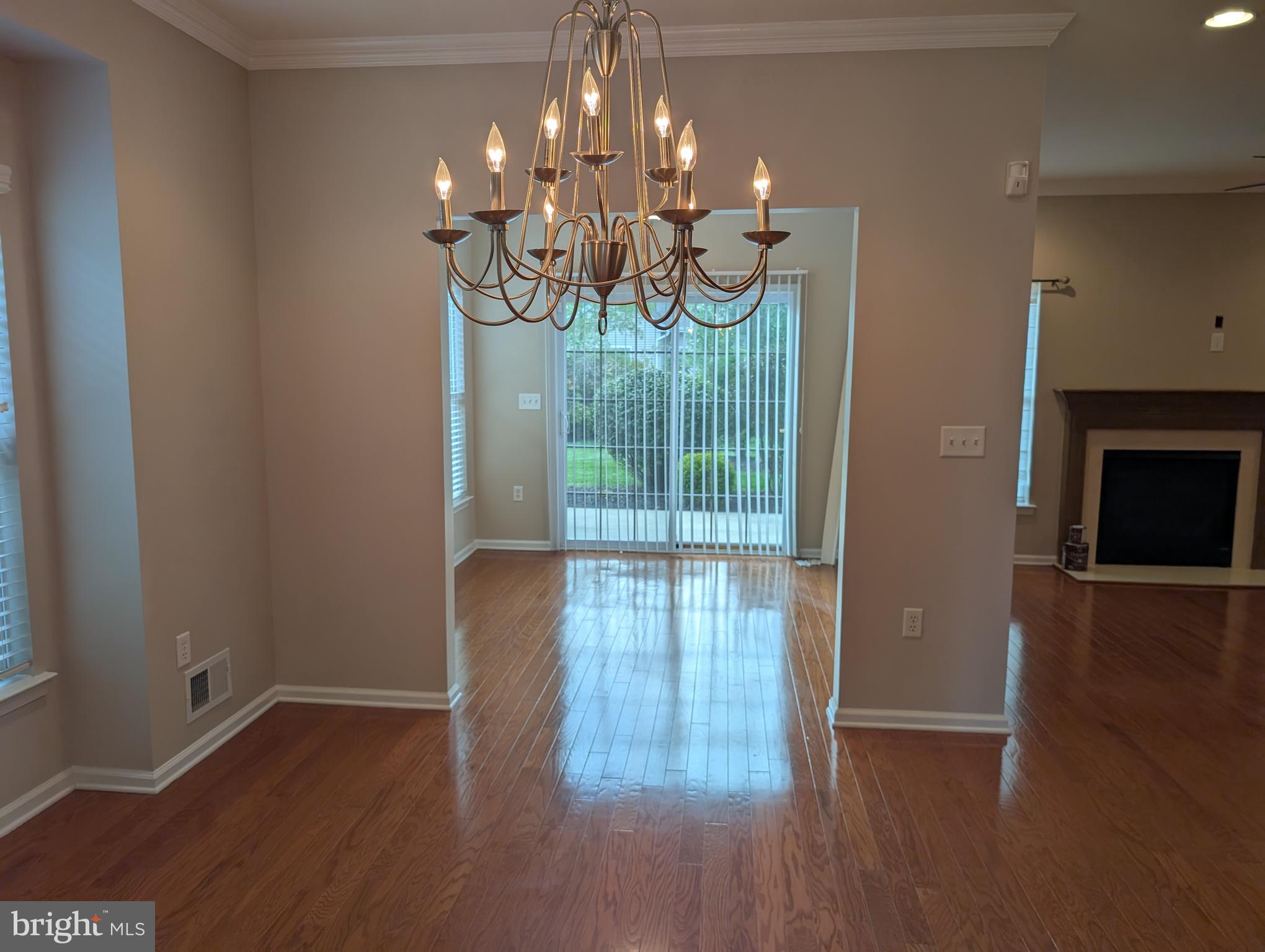 302 Gosling Way Glassboro, NJ 08028 - Photo 6 of 13 a view of a room with wooden floor and chandelier