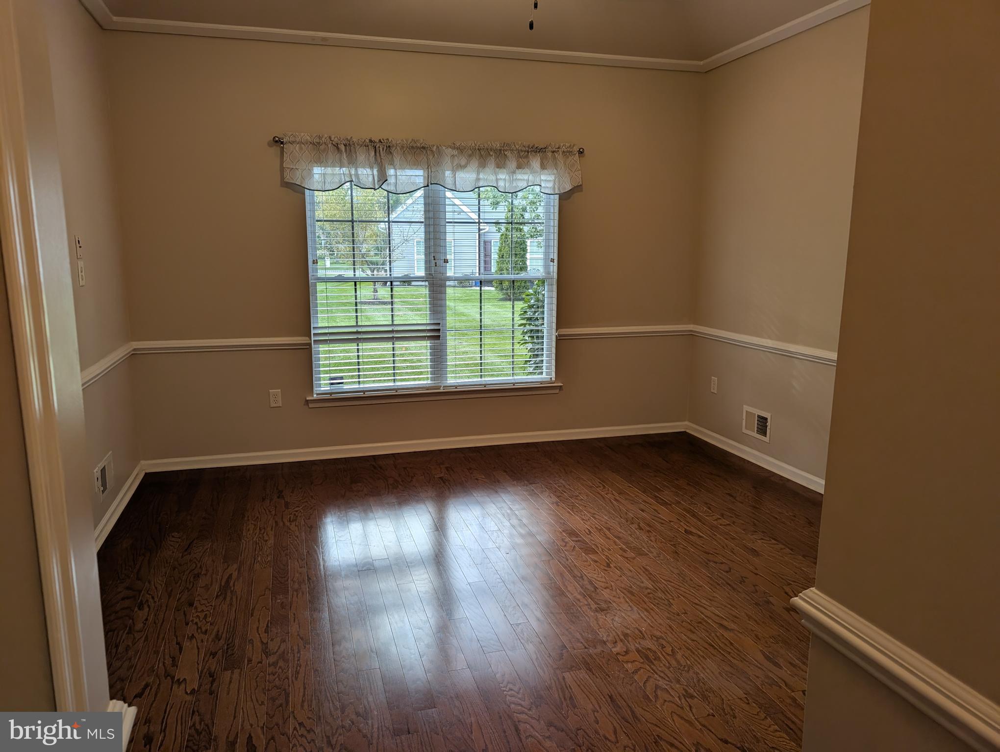 302 Gosling Way Glassboro, NJ 08028 - Photo 8 of 13 an empty room with wooden floor and windows