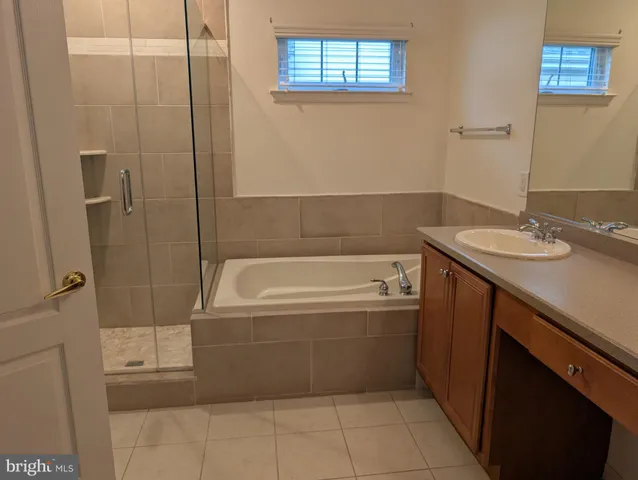 a bathroom with a bathtub and a sink