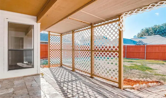 a view of a porch with a floor to ceiling window