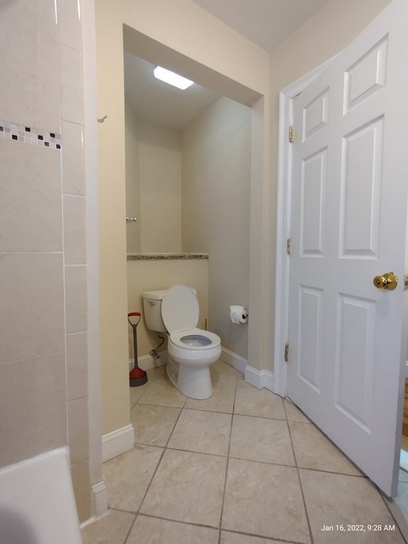 62 Washington Street, Unit 62 Wellesley, MA 02481 - Photo 11 of 18 a bathroom with a toilet and a shower