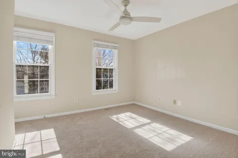 a view of an empty room with windows