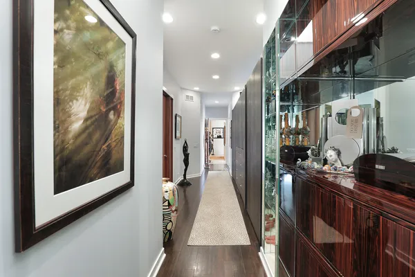 a view of a hallway view with wooden floor and staircase