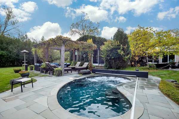 a view of a garden with a bench in a garden