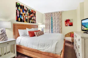 a bedroom with a bed and a couch