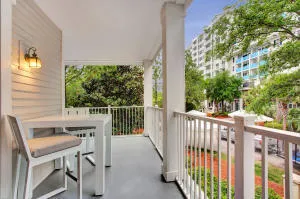 a view of a balcony with furniture