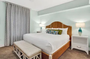 a bedroom with a bed and a night stand